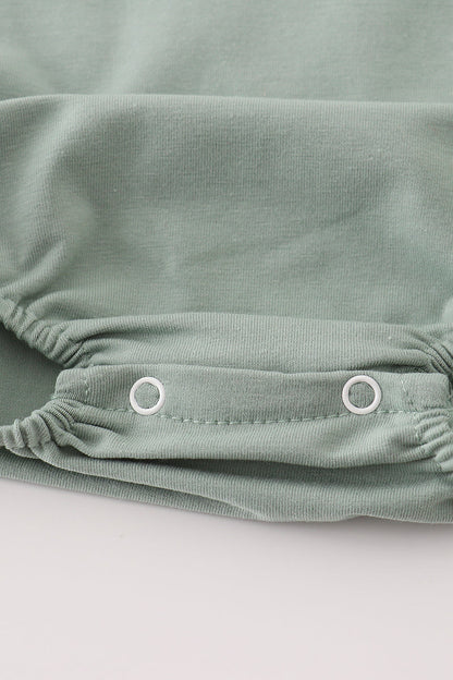 Green character applique bubble